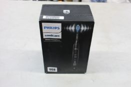 A Boxed as new Phillips Sonicare 9000 Diamond clean electric toothbrush.