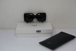 A pair of as new Celine sunglasses.