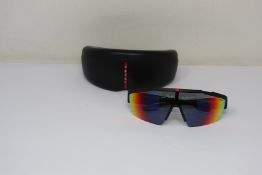 A pair of as new Prada sunglasses.