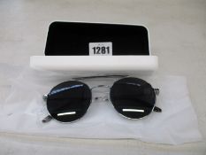 A pair of as new Calvin Klein sunglasses.