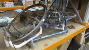 A vintage Peugeot road bike, a vintage Carraro road bike with two wheels (Both pre-owned and have