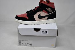 A pair of women's as new Nike Air Jordan 1 Mid (UK 6.5).