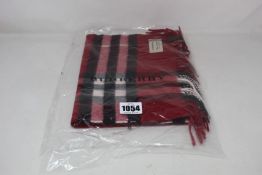 An as new Burberry Giant Check cashmere scarf in parade red.