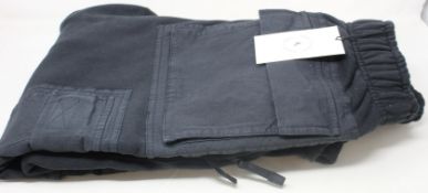 A pair of as new Travis Scott x Nike NRG AG utility sweatpants (M).