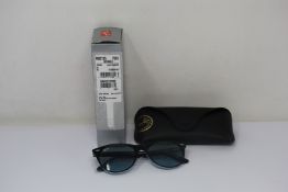 A pair of as new Ray Ban sunglasses.