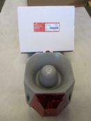 A Cooper Wheelock ASRS-R-DC Multi-Alarm 24VDC Outdoor 104075, grey/red strobe.