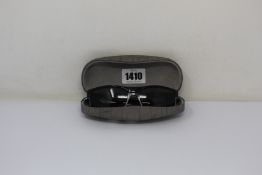 A pair of as new Calvin Klein sunglasses.