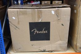 A boxed Fender Tone Master Deluxe Reverb-Amp (Box has some minor damage).