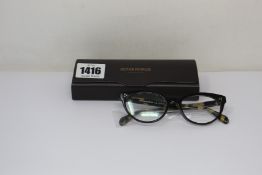 A pair of Oliver Peoples Arella glasses frames.