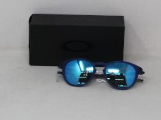 A boxed as new pair of Oakley Pitchman R glasses matte translucent blue frame with Prizm Sapphire