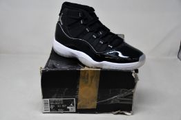 A pair of as new Nike Air Jordan 11 Retro (UK 7.5 - Damaged box).
