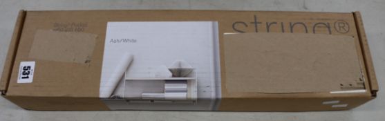 A boxed as new String Furniture Pocket Shelf in ash/white.