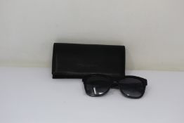 A pair of as new Chanel sunglasses.