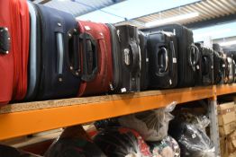 A quantity of empty suitcases/holdalls (Approximately 40 items).
