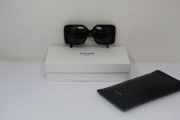 A pair of as new Celine sunglasses.