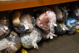 Thirteen bags of assorted pre-owned clothing and related items.