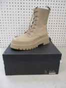 A pair of as new Uterque Botin track boots in beige (EU 38).