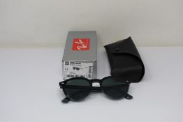 A pair of as new Ray Ban sunglasses.