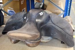 A pre-owned Ideal Wintec horse saddle and a pre-owned MG Saddlery horse saddle.
