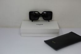 A pair of as new Celine sunglasses.