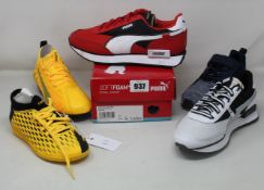 Five pairs of children's/junior assorted Puma trainers.