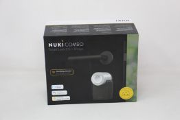 A boxed as new Nuki Combo Smart lock 2.0 + Bridge (Compatible with UK sockets).