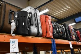 A quantity of empty suitcases/holdalls (Approximately 30 items).