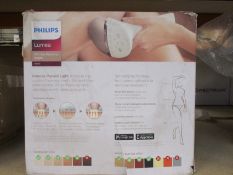 A Philips Lumea 9000 Series IPL hair removal device (Some damage to box).