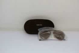 A pair of as new Tom Ford sunglasses.