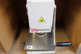 A pre-owned Instron hollow die punch (C-6051-000).