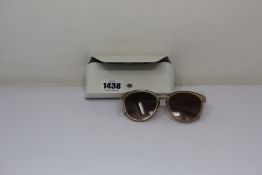 A pair of as new Michael Kors sunglasses.