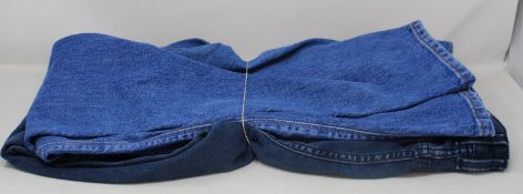 Two pairs of as new Hugo Boss jeans (W30/L32, W42/L34).