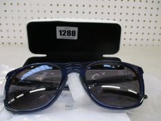 A pair of as new Calvin Klein sunglasses.