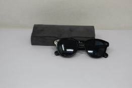 A pair of as new Oliver Peoples Cary Grant sunglasses.