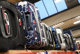 Eleven suitcases/holdalls to include Samsonite, American Tourist, Berghaus and Away.