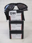 Three boxed of as new Oakley Anorak sunglasses polished black frame with prizm grey lenses (