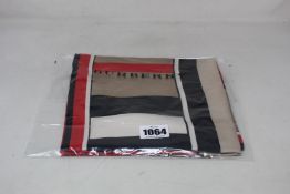 An as new Burberry 8016226 Monogram Icon scarf.