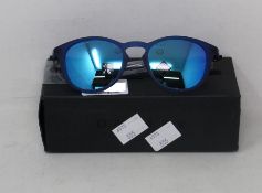 A boxed as new pair of Oakley Pitchman R glasses matte translucent blue frame with Prizm Sapphire
