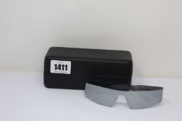 A pair of as new Balenciaga sunglasses.