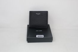 An as new Yves Saint Laurent black wallet.