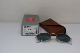 A pair of as new Ray Ban sunglasses.