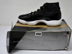 A pair of as new Nike Air Jordan 11 Retro (UK 9.5 - Damaged box).