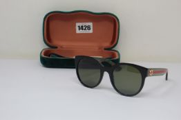 A pair of as new Gucci sunglasses.