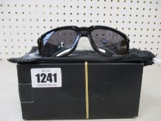 Two boxed of as new Oakley Anorak sunglasses polished black frame with prizm grey lenses (