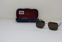 A pair of as new Gucci sunglasses.