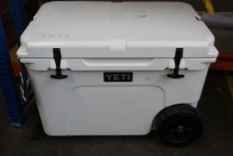 A Yeti Tundra Haul cool box with wheels in white.