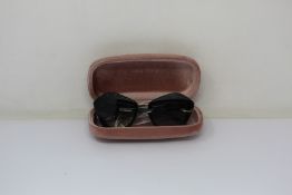 A pair of as new Mui Mui sunglasses.