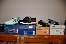 Four pairs of children's assorted as new Asics trainers.