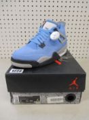 A pair of youths as new Nike Air Jordan 4 Retro (UK 6).