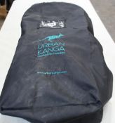 A Babyzen Yoyo bag and an Urban Kanga TV107 portable travel seat.